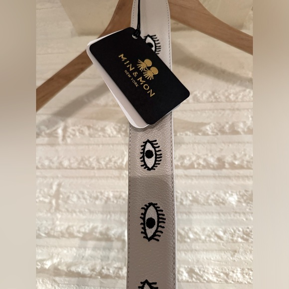 Min & Mon Handbags - Min & Mon white eye purse strap new with tags